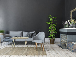 Monochomatic_Trendy_Living_Room_timber_floor_fireplace_rug_plant_grey_couch